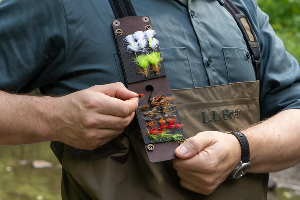 Leather and rubber fly wallet for fly fishing attached to wader strap 