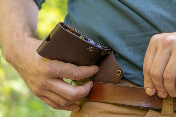 Attaching a leather and rubber fly wallet for fly fishing to belt using the strap snap system