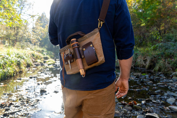 Carrying a Daggerfish Field Bag with a Deluxe Handline Kit in a stream