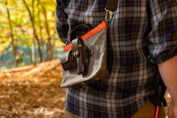 Carrying a Hunter Field Bag across back with a Foraging Kit attachedto to MOLLE webbing