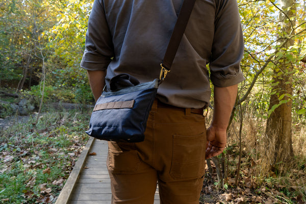 Carrying a Daggerfish Marine Field Bag into the woods