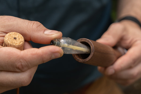 Storing a casting bubble inside of a black walnut handline